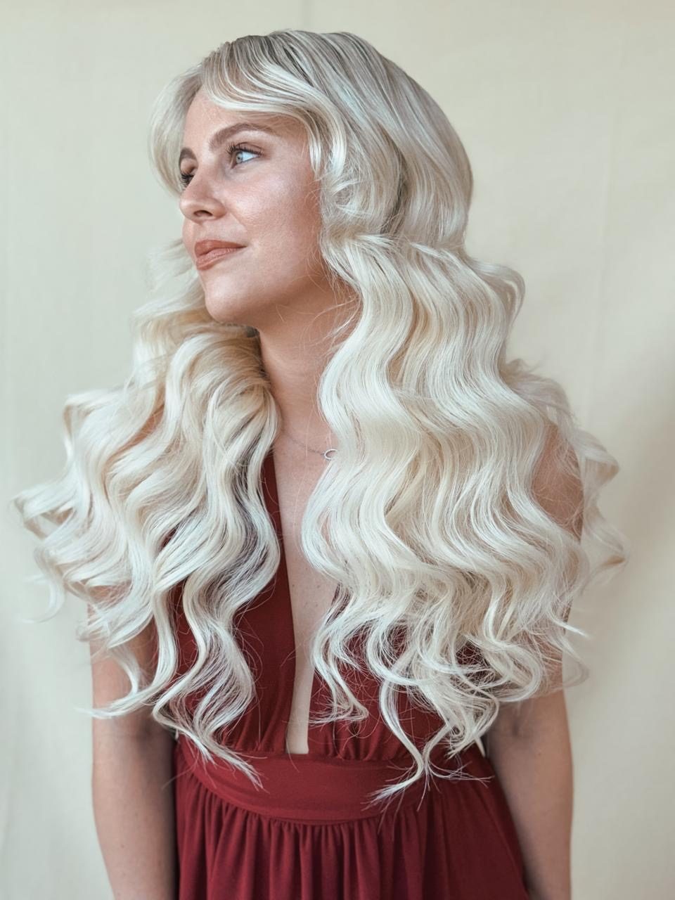 Model with soft blonde waves and fringe
