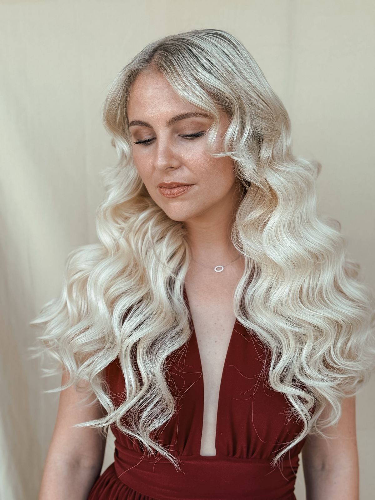 Client with long wavy blonde extensions, soft waves