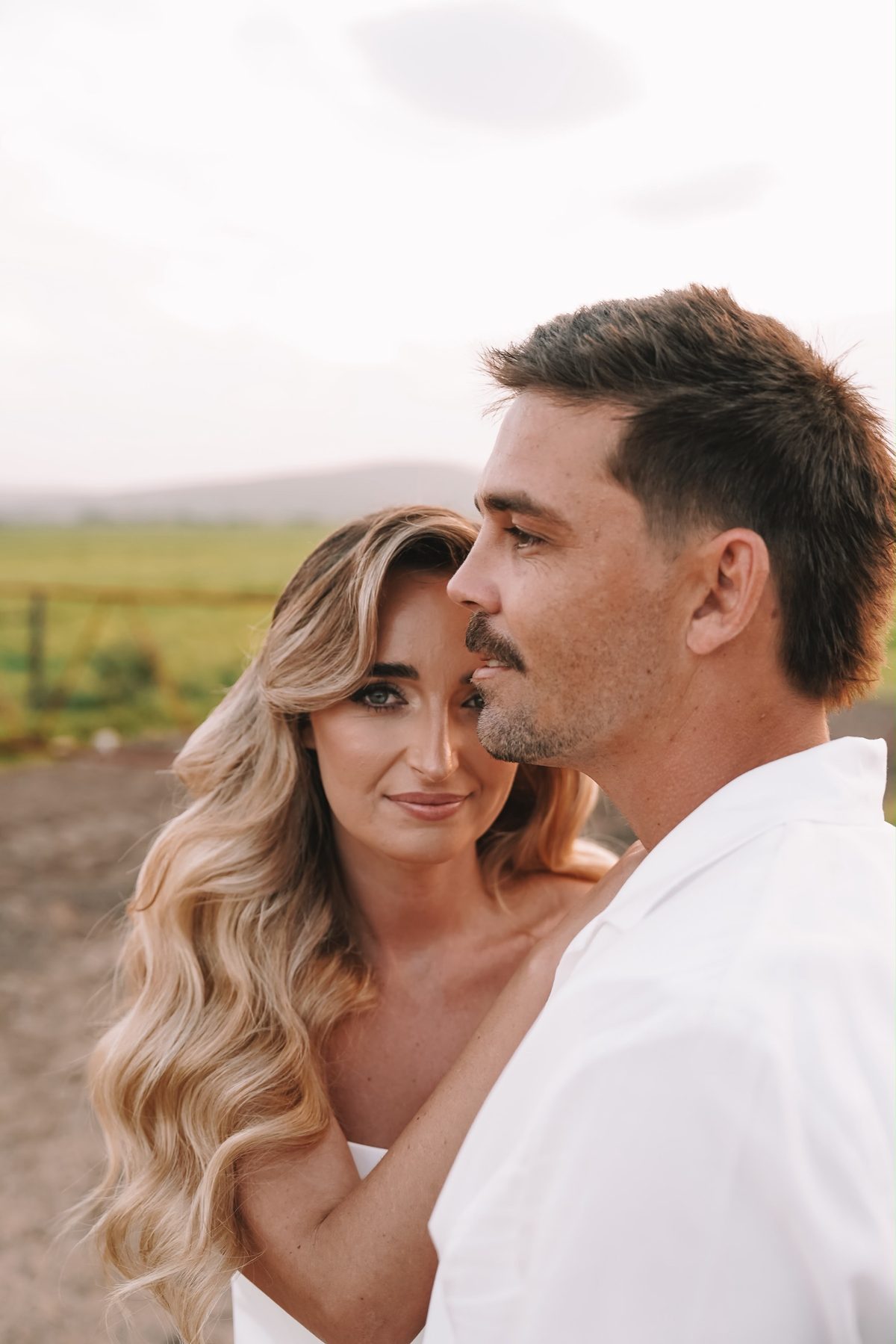 Bride and groom foreheads close together
